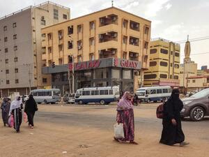 Women walk along a street in the south of Khartoum on April 24, 2023. (Photo by AFP) Sudan
