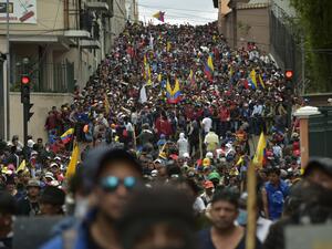 Protesters march against President Lenin Moreno's decision to slash fuel subsidies, in Quito on October 9, 2019. Unions and other groups alongside thousands of farmers and indigenous people are expected in the streets of the capital Quito. 