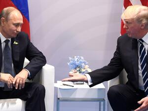 US president Trump (R) meets with Russian counterpart Putin. (Saul Loeb/AFP/Getty Images)