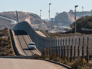 Border Patrol vehicle patrolling along the fence of the international border between San Diego, California and Tijuana, Mexico. (Shutterstock/ File Photo)