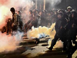 Indonesian police shoot tear gas to disperse protesters during a demonstration outside the Elections Oversight Body (Bawaslu) in Jakarta on May 22, 2019. (AFP)