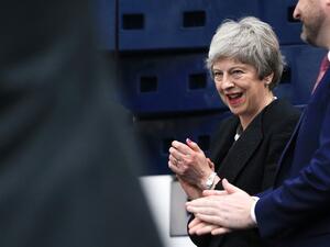 Britain's Prime Minister Theresa May gestures during a visit to the Leisure Box in Brierfield, Lancashire, on April 25, 2019, during campaigning for the local elections.  (Peter Byrne / POOL / AFP)