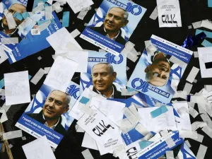 Israeli Likud Party campaign material and posters of Prime Minister Benjamin Netanyahu strown on the floor following election night at the party headquarters in the coastal city of Tel Aviv. (Jack GUEZ / AFP)