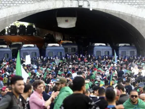 Algerian police stand guard as protesters gather during an anti government demonstration in the capital Algiers on April 26, 2019. (AFP)