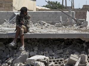 A man sits amidst the rubble of a building, destroyed during airstrikes by the Syrian regime and their allies near the town of Saraqeb in Syria's rebel-held northwestern province of Idlib on May 7, 2019. (AFP)