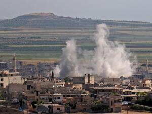 Smoke billows following regime bombardment on the town of Khan Shaykhun in the southern countryside of the rebel-held Idlib province on May 14, 2019. (AFP)