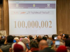 A picture taken on February 11, 2020, shows a screen displaying the population count at the Egyptian Ministry of Planning headquarters in the capital Cairo. Egypt's population reached 100 million on Sunday. AFP