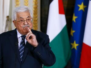 Palestinian Authority President Mahmoud Abbas gestures during a press conference with the French president, following a meeting at the Elysee presidential palace in Paris. (AFP Photo/Pool/Francois Mori)