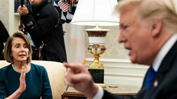 Then-House Minority Leader Nancy Pelosi (L) and US President Donald Trump argue while making statements to the press before a meeting at the White House in Washington, DC, on December 11, 2018. (AFP) Then-House Minority Leader Nancy Pelosi (L) and US President Donald Trump argue while making statements to the press before a meeting at the White House in Washington, DC, on December 11, 2018. (AFP)