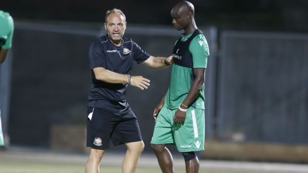 Harambee Stars coach Sebastien Migne and Dennis Odhiambo. (Photo: goal.com)