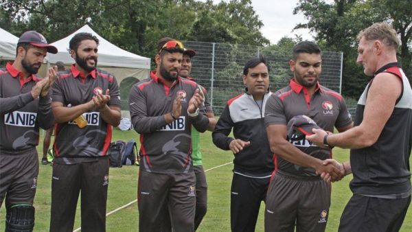The UAE's Darius D'Silva receives his cap on his T20i debut against the Netherlands. - Twitter