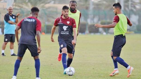 Oman striker Abdulaziz al Miqbali (centre) and defender Mohammed al Mussalami (right) at a training session