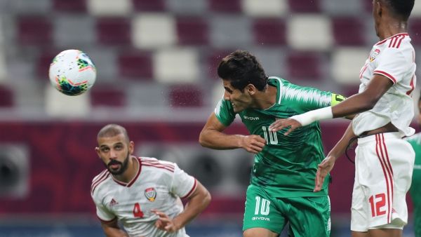 Iraq's Alaa Abdul Zahra (centre) scores from a header against the UAE in Doha on Friday. (AFP)