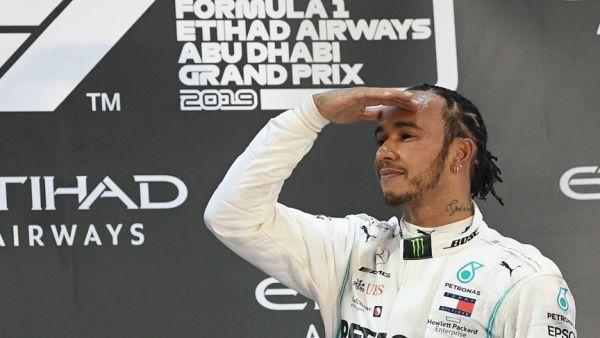 Mercedes' Lewis Hamilton celebrates after winning the final race of the Abu Dhabi Formula One Grand Prix at the Yas Marina Circuit. - Photo by Ryan Lim