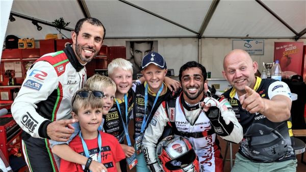 Frode Sundsdal (right) with Rashed Al Qemzi, Rashid Al Tayer (left) and young fans at the Grand Prix of Norway earlier this year. (Supplied photo)