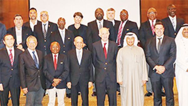 Chairman of FINA Julio Maglione with First Deputy Chairman of FINA Hussain Al-Musallam pose for a group photo during the FINA meeting in Kuwait.