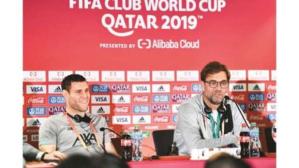 Liverpool manager Jurgen Klopp (right) speaks at a press conference as player James Milner looks on on the eve of the semi-final against Monterrey in Doha. Photo: Noushad Thekkayil