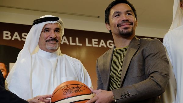 Manny Pacquiao presenting signed basketball to Saeed Hareb, Director General Dubai Sports Council at the Dubai Sports Council office (KT file)
