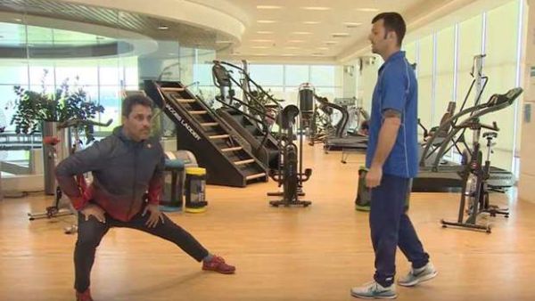 Rally driver Nasser Saleh al-Attiyah (left) stretches during Aspetar’s online training session.