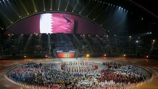 A general view of the Khalifa Stadium with the Qatari flag being displayed on a screen during the closing ceremony of the 15th Asian Games in Doha, December 15, 2006 (Photo: Gulf Times)