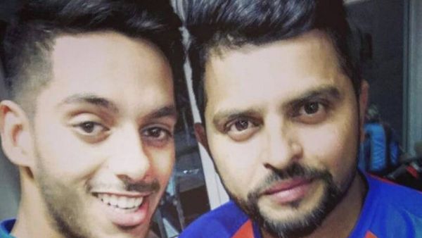 UAE opening batsman Chirag Suri with Suresh Raina. Suri was picked by Gujarat Lions in the 2017 IPL. (Supplied photo)