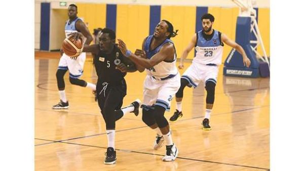 Al Sadd (in black) and Al Wakrah players vying for the ball during their Amir Cup basketball semi-final at the Al Gharafa Sports Club yesterday. (Photo: Shemeer Rasheed)