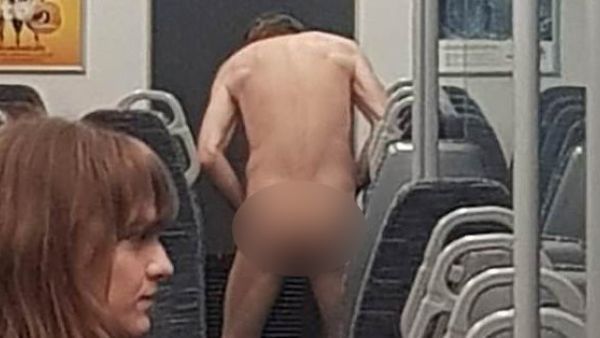 This is the shocking moment when a man gets completely naked on a London commuter train before being removed by police.
