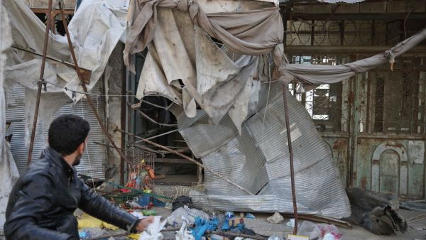 At least 12 people were killed and 18 others wounded in overnight strikes on the Idlib town of Maarat al-Numan, the Britain-based Syrian Observatory for Human Rights said. (Aaref WATAD / AFP)