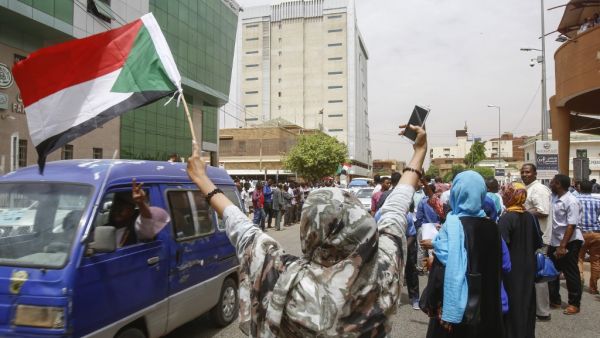 Employees demonstrate outside Bank of Khartoum on May 28, 2019 as they participate in a two-day national strike to step up pressure on the ruling military council. (AFP/File)