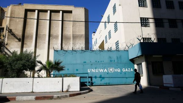 A Palestinian man walks past the building of the UNRWA headquarters in Gaza City on January 8, 2018. (MOHAMMED ABED/AFP/Getty Images) 
