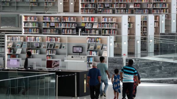 People visit the interior of the Qatar National Library in the capital Doha on May 19, 2019. The Gulf's largest book collection, Qatar's National Library is one-year-old and has enhanced ties with libraries outside the region as the anti-Doha boycott drags on while also wooing younger readers. (AFP/ File Photo)