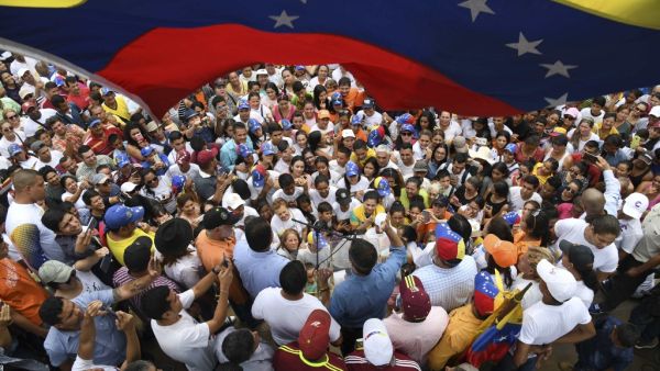 Venezuelan opposition leader and self-proclaimed interim president Juan Guaido (C, blue shirt) delivers a speech to supporters during a gathering in Socopo, Barinas State, Venezuela, on June 1, 2019. (AFP/ File Photo)