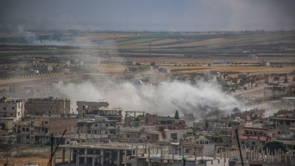 Plumes of smoke rise following reported Syrian government forces' bombardment on the town of Khan Sheikhun in the southern countryside of the jihadist-held Idlib province, on June 5, 2019.  Anas AL-DYAB / AFP