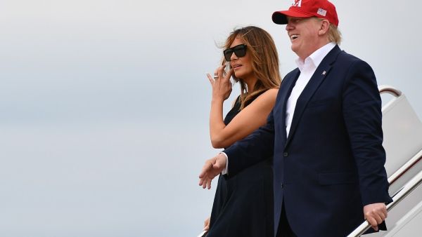 US President Donald Trump and First Lady Melania Trump step off Air Force One upon arrival at Andrews Air Force Base in Maryland on June 07, 2019. (MANDEL NGAN / AFP)