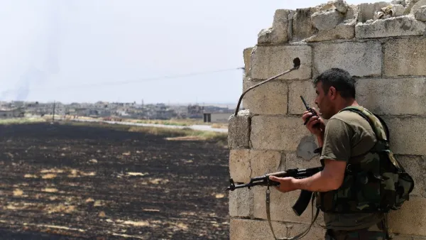 A fighters with the Syrian regime forces holds a position in the town of Jalamah in Syria's Hama governorate during clashes with jihadists on June 8, 2019. (George OURFALIAN / AFP)