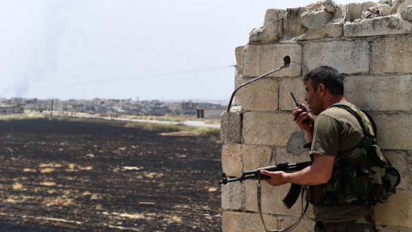 A fighters with the Syrian regime forces holds a position in the town of Jalamah in Syria's Hama governorate during clashes with jihadists on June 8, 2019. (George OURFALIAN / AFP)