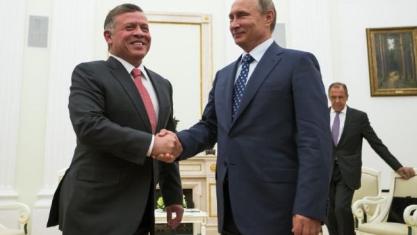 Russian President Vladimir Putin shakes hands with Jordanian King Abdullah II during a meeting at the Kremlin in Moscow (AFP)