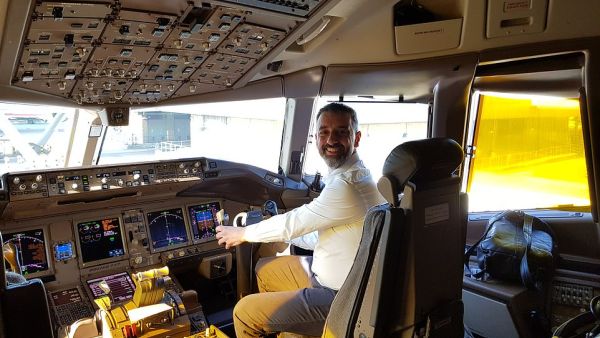 Ted at the controls of the Boeing 777 at Heathrow's Terminal 3 before it took him to Dallas. (Daily Mail)