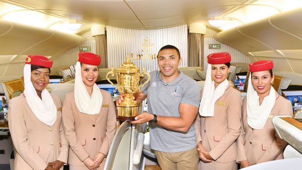 Bryan Habana on board Emirates flight EK 318 with the Webb Ellis Cup on its way to Japan
