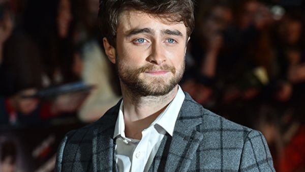 British actor Daniel Radcliffe poses for photographers on the red carpet as he arrives for the UK Premier of "Horns" in central London. (AFP)