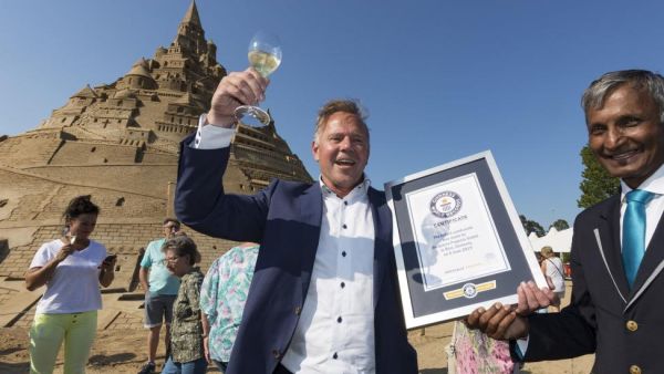 A sandcastle completed at the Sand Sculpture Festival in Binz, Germany, on Wednesday was dubbed the tallest sandcastle in the world by Guinness World Records. (Photo by Jens Koehler/EPA-EFE)