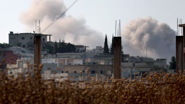 Smoke billows in the village of Hamameya in Syria's Idlib province on July 11, 2019 during clashes between jihadists and fighters from Syria's former Al-Qaeda affiliate Hayat Tahrir al-Sham (HTS). (AFP/ File Photo)