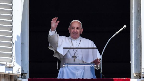 Pope Francis waves to the crowd from the window of the apostolic palace overlooking St Peter's square during the Sunday Angelus prayer, on July 14, 2019 in Vatican. (Andreas SOLARO / AFP)
