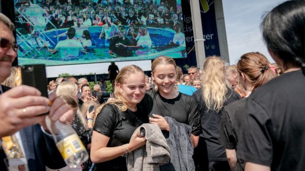 Jehovah's Witnesses react after receiving the baptism during a group baptism event during an international convention at Broendby Stadium on July 20, 2019 in Copenhagen.  Ida Marie Odgaard / Ritzau Scanpix / AFP