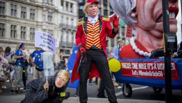 Anti-Brexit campaigners dressed as US President Donald Trump (R) and Conservative party leadership contender Boris Johnson take part in the March for Change 'No to Boris:Yes to Europe' demonstration in central London on July 20, 2019. (Tolga Akmen / AFP)