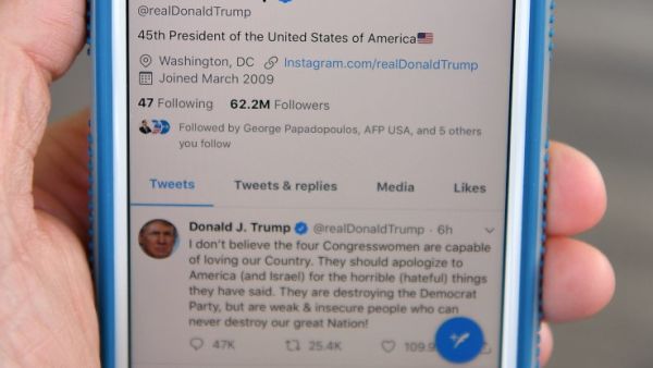 A July 21, 2019 photo of a cell phone showing the Twitter page of US President Donald Trump in Morristown, New Jersey. Trump renewed his attack on four Democratic congresswomen. MANDEL NGAN / AFP