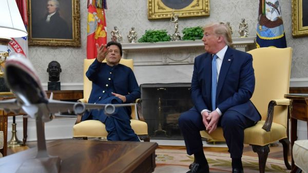 US President Donald Trump shakes hands with Pakistani Prime Minister Imran Khan (L) during a meeting in the Oval Office at the White House in Washington, DC, on July 22, 2019. (Nicholas Kamm / AFP)