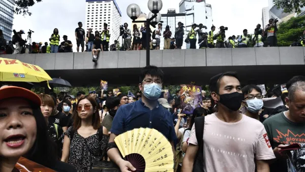 Protesters march during a demonstration in Hong Kong (AFP)