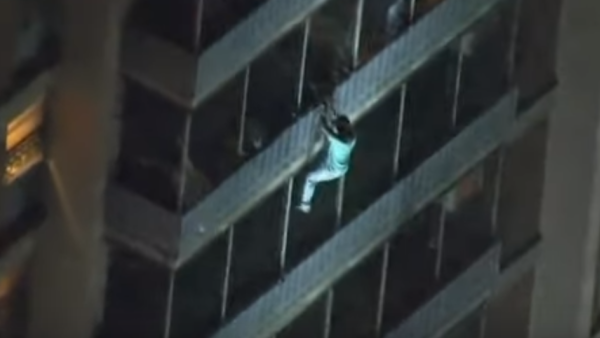 A Philadelphia man's love for his bedridden mother made headlines when he scaled a burning 19-storey building to save her. (YouTube Screenshot)