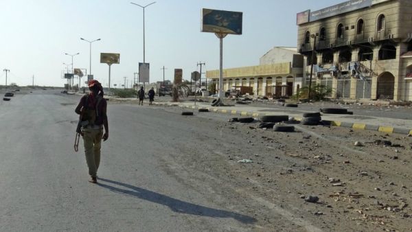 A Yemeni pro-government fighter walks with a rifle in the Houthi-held Red Sea port city of Hodeida. (AFP/ File Photo)
